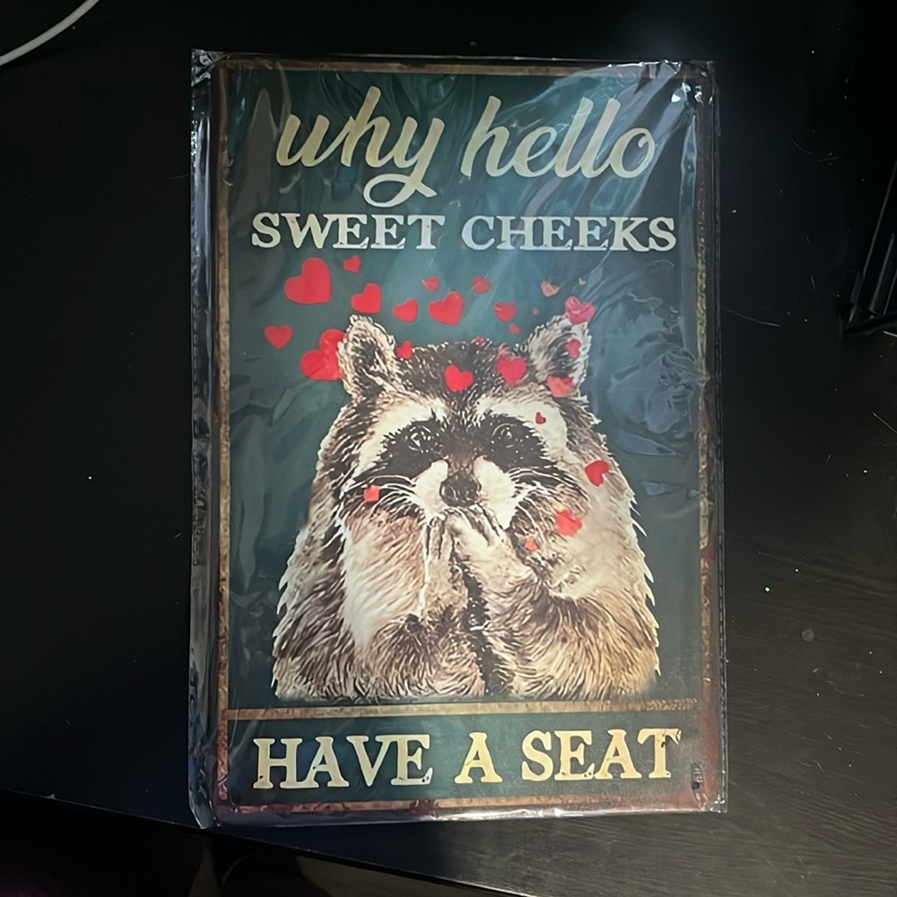 Hello sweet cheeks Raccoon sign